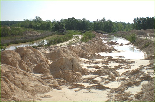 Settling pond dredged for recycled material