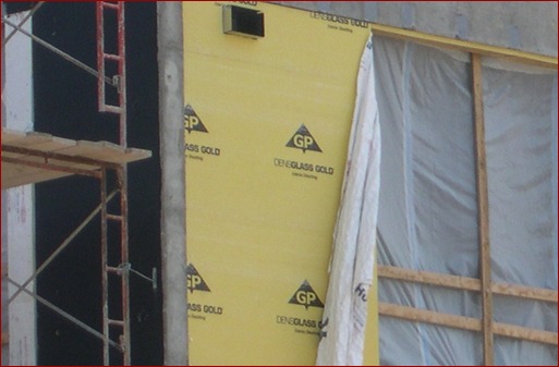 Adhesion of fabric wraps can be problematic as shown here. The best fluid-applied barriers will adhere through the worst conditions, even before cladding goes up.