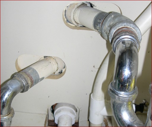 Air-carried energy dollars begin their escape from living and working spaces through penetrations like these underneath a sink. Unless there’s a seamless, continuous, durable air barrier to stop it, that expensively conditioned air will find a way to leave the building, just the same as if you left a window or door open.