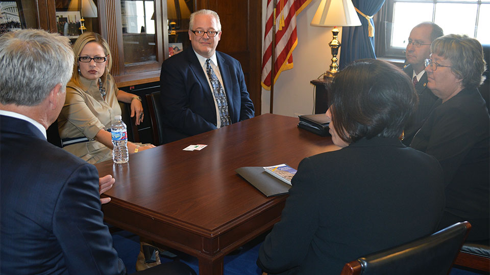 Mark Kemp, Jeff Buczkiewicz, Lisa Prichard, Mike Sutter, and Colleen Sutter discuss issues affecting the masonry industry with Representative Kyrsten Sinema (D-AZ)