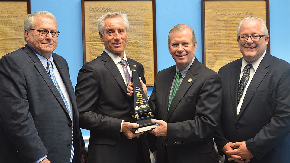 John Topp, Mark Kemp, and Jeff Buczkiewicz present the MCAA Freedom and Prosperity Award to Representative Tim Walberg (R-MI)