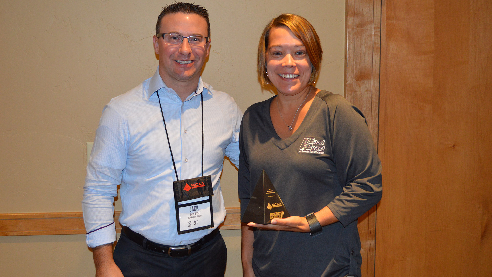 Stacy Rougeau is presented the MCAA Safety Advantage Award by Jack West (Federated Insurance).