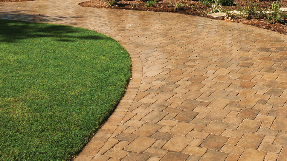 Figure 2: Exterior driveway/walkway treated with acrylic, scuff resistant coating; finishes typically come in natural or wet-look appearance (wet-look shown here).