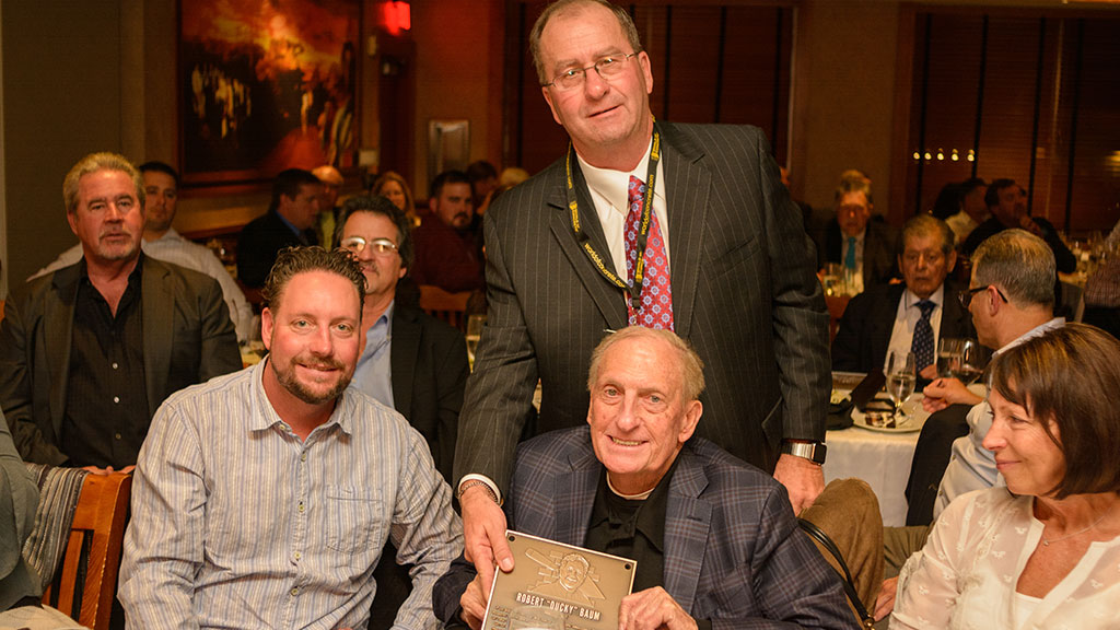 MCAA Chairman Mike Sutter (back) presents Robert