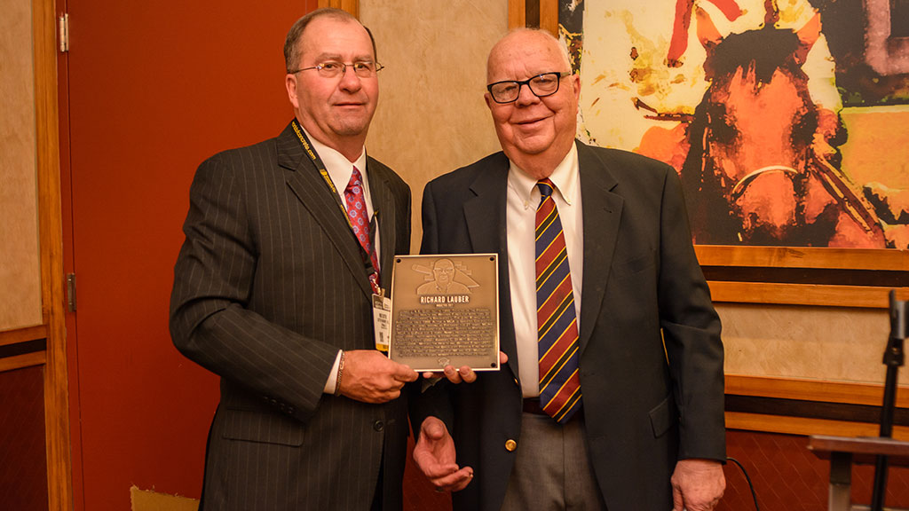 MCAA Chairman Mike Sutter (left) presents Richard Lauber with his Masonry Hall of Fame plaque.