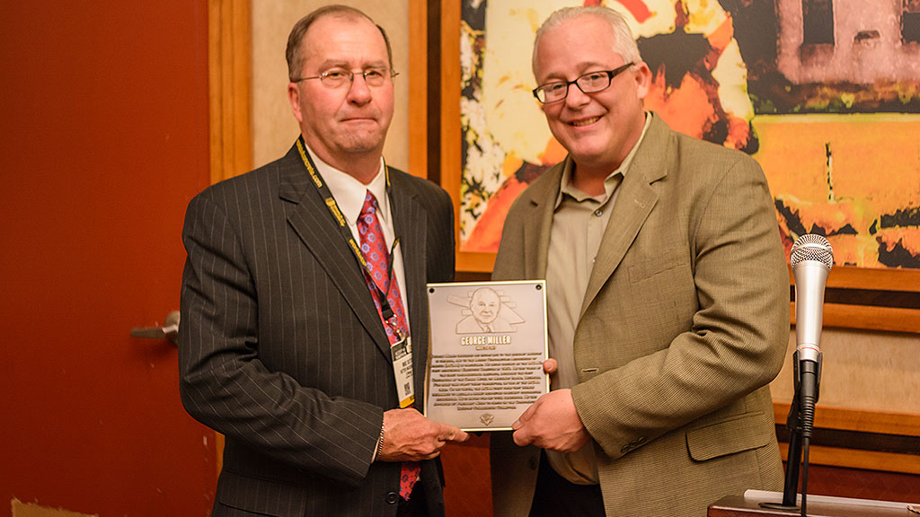 MCAA Chairman Mike Sutter (left) presents Jeff Buczkiewicz with the Masonry Hall of Fame plaque for George Miller.