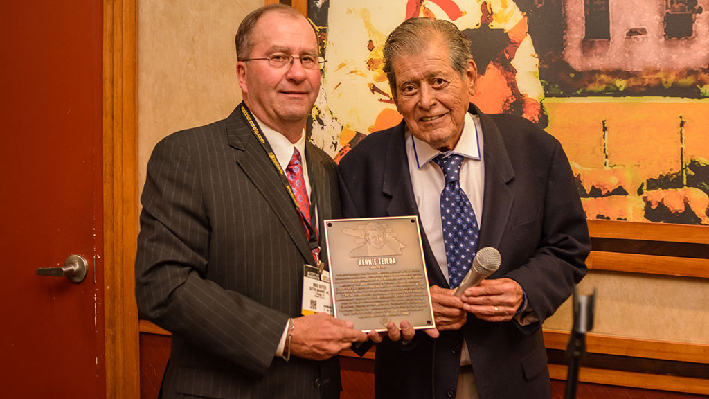 MCAA Chairman Mike Sutter (left) presents Rennie Tejeda with his Masonry Hall of Fame plaque.