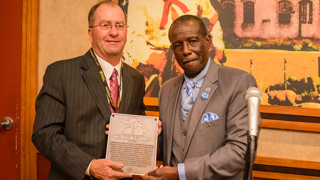 MCAA Chairman Mike Sutter (left) presents Milton H.