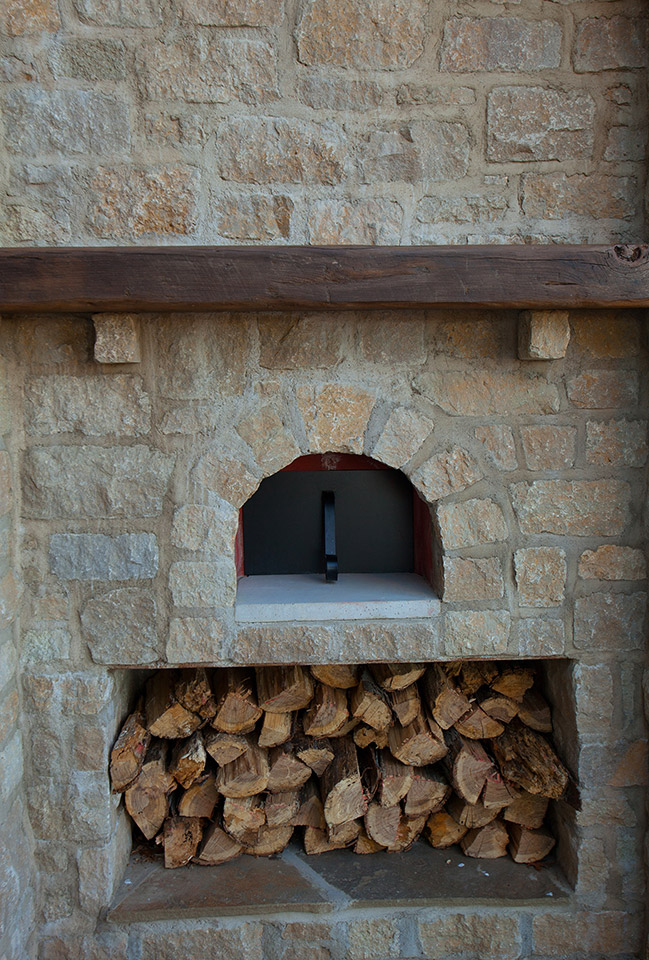 A wood fired pizza oven on the patio is a unique feature of the home.