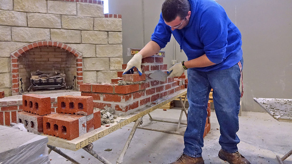 Christopher Brubaker, 20, an adult student at Meridian Technology Center, works on constructing a brick wall. Photo by David Bitton/Stillwater News Press.