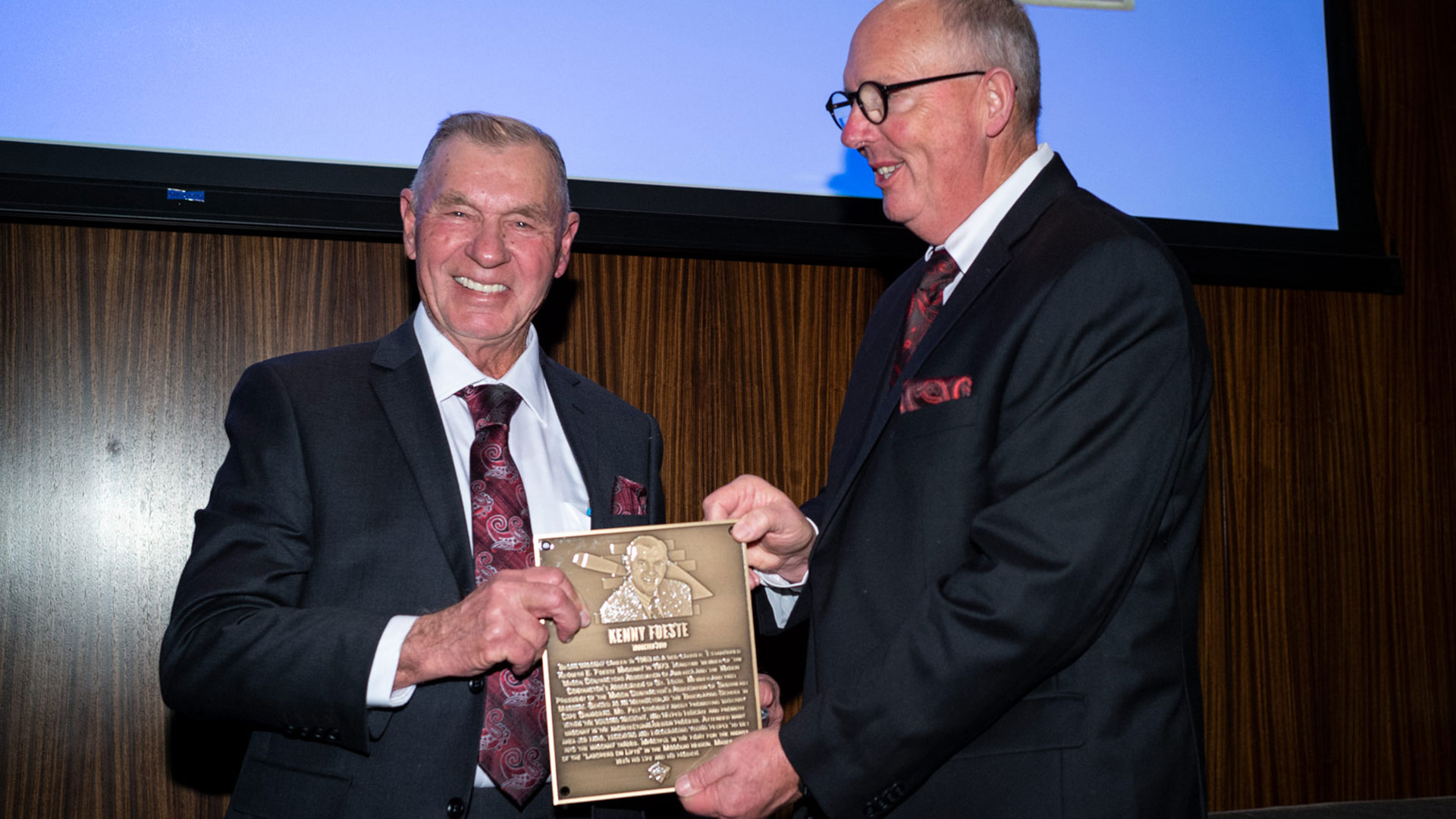 MCAA Chairman Paul Odom (right) presents Kenny Foeste with his Masonry Hall of Fame plaque.