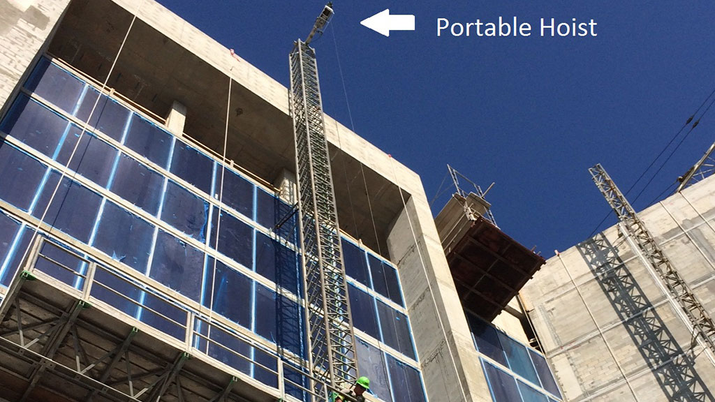 Contractor on a Scanclimber SC5000 at the Westin Hotel in Sarasota, Fla., lifting stucco with Leo hoist. Photo courtesy of Sunbelt Rentals.