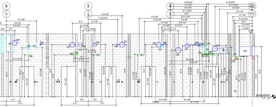 This partial elevation view of the composite model locates the MEP sleeve penetrations for the bricklayers. Each sleeve has a unique number and is color-coded per trade, as outlined in the caption to Figure 2.