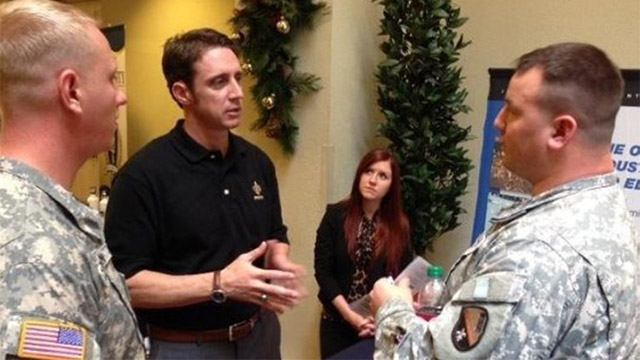 Chris Newton of Cajun Industries speaks to service members about construction careers